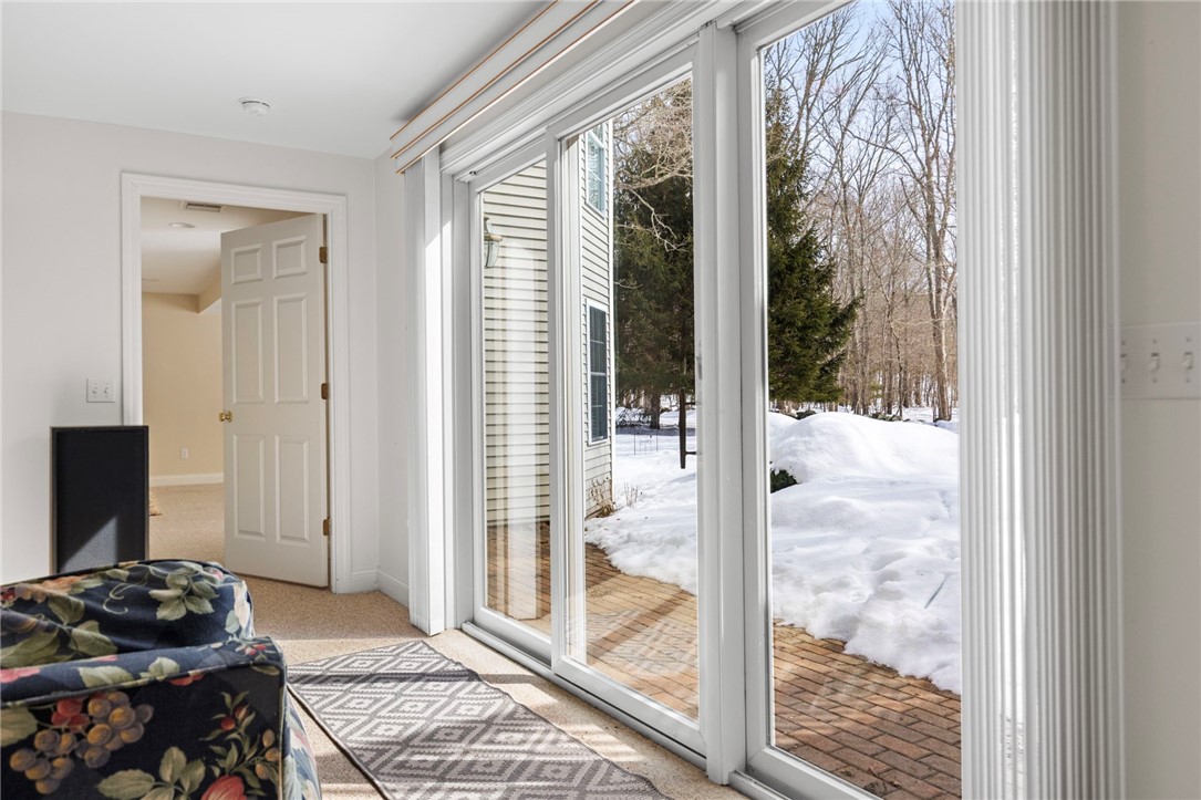 30 Fox Ridge Circle South Kingstown, RI 02879 - Photo 31 of 38 Family room in finished basement. Sliders lead to the patio.