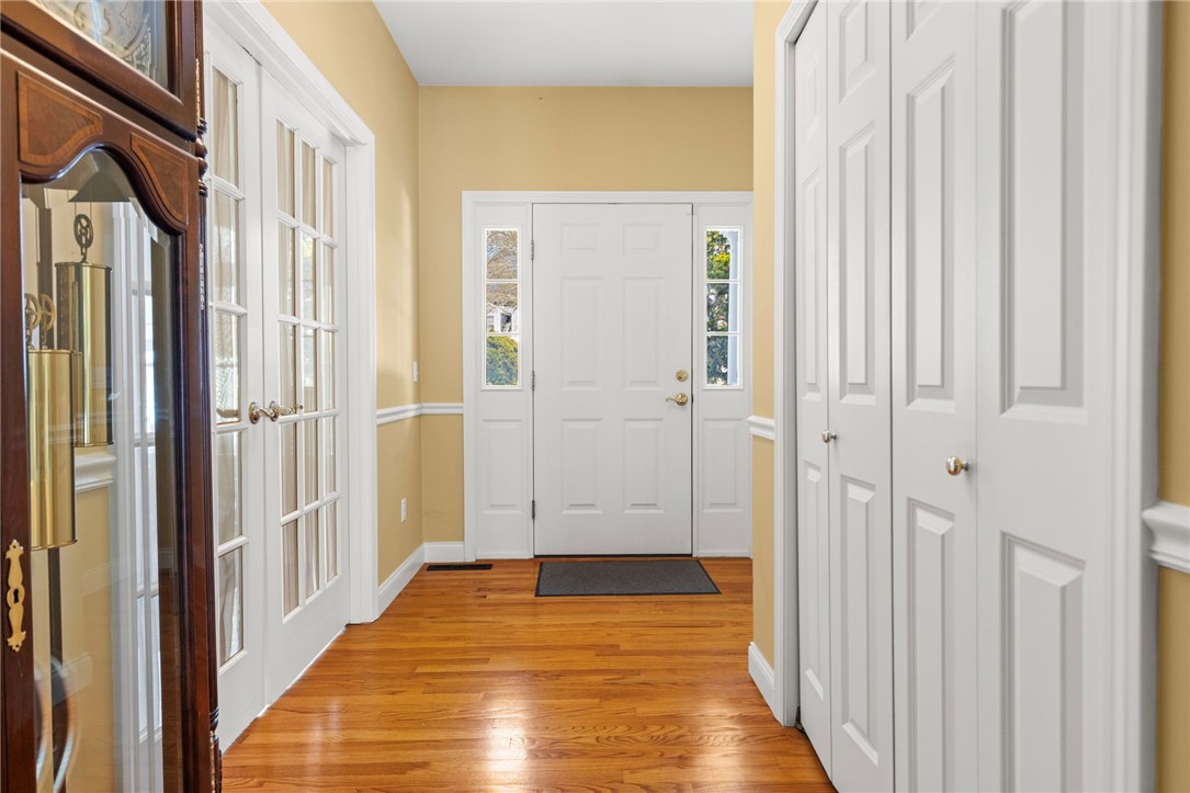 30 Fox Ridge Circle South Kingstown, RI 02879 - Photo 7 of 38 The foyer features French doors leading to the formal dining room and a large coat closet.