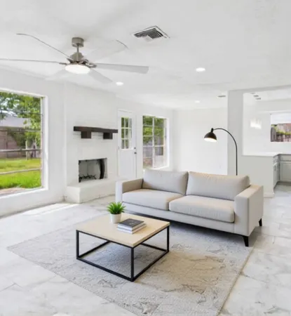 a living room with furniture and a fireplace