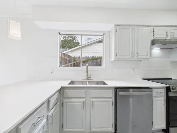 a view of a kitchen with a sink