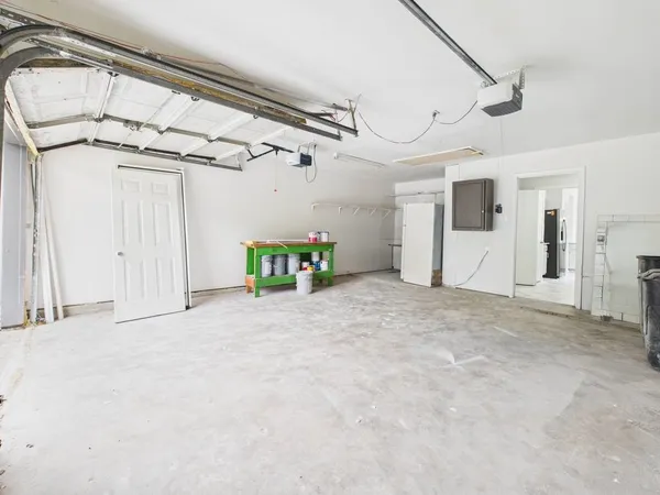a view of empty room with cabinet