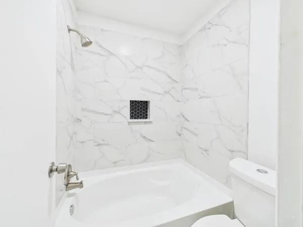 a view of a kitchen with a sink and windows