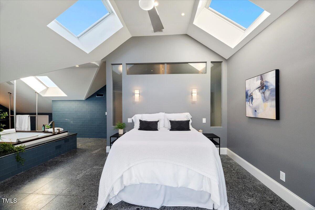 255 Penley Circle Raleigh, NC 27609 - Photo 14 of 35 a bedroom with a bed and a lamp