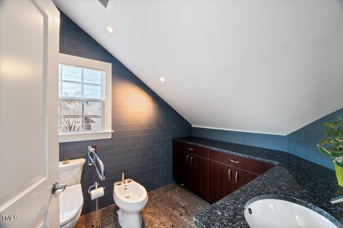 255 Penley Circle Raleigh, NC 27609 - Photo 18 of 35 a bathroom with a toilet and a sink
