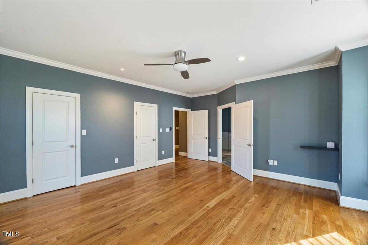 255 Penley Circle Raleigh, NC 27609 - Photo 20 of 35 a view of a livingroom with a chandelier fan and windows