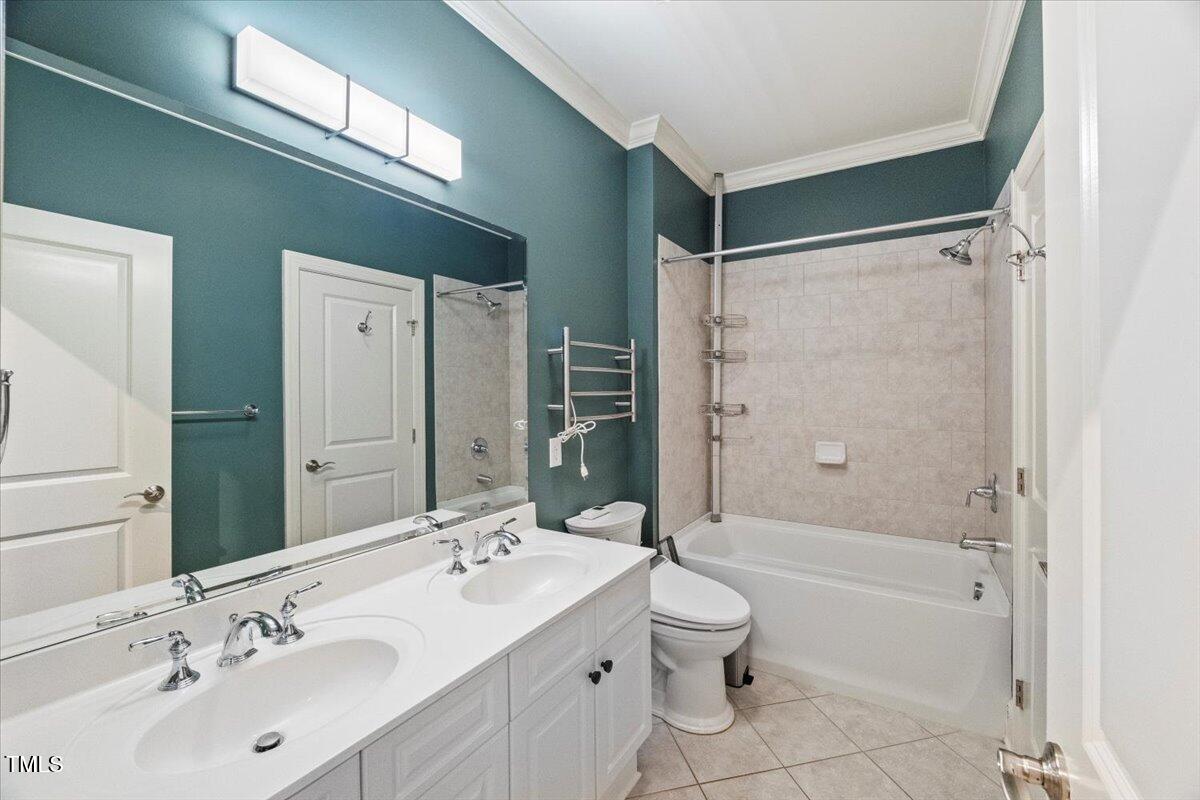 255 Penley Circle Raleigh, NC 27609 - Photo 24 of 35 a bathroom with a sink toilet and shower