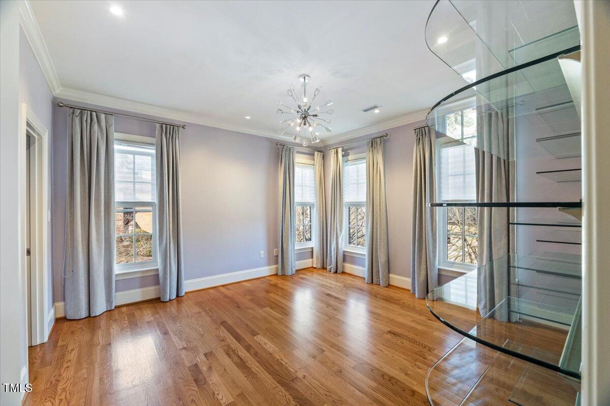 255 Penley Circle Raleigh, NC 27609 - Photo 25 of 35 wooden floor in an empty room with a window