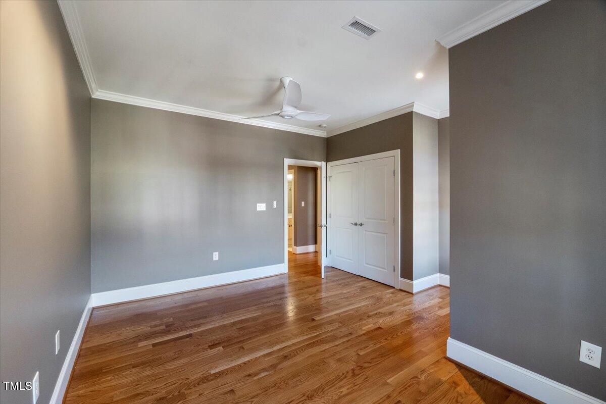 255 Penley Circle Raleigh, NC 27609 - Photo 26 of 35 wooden floor in an empty room with a window