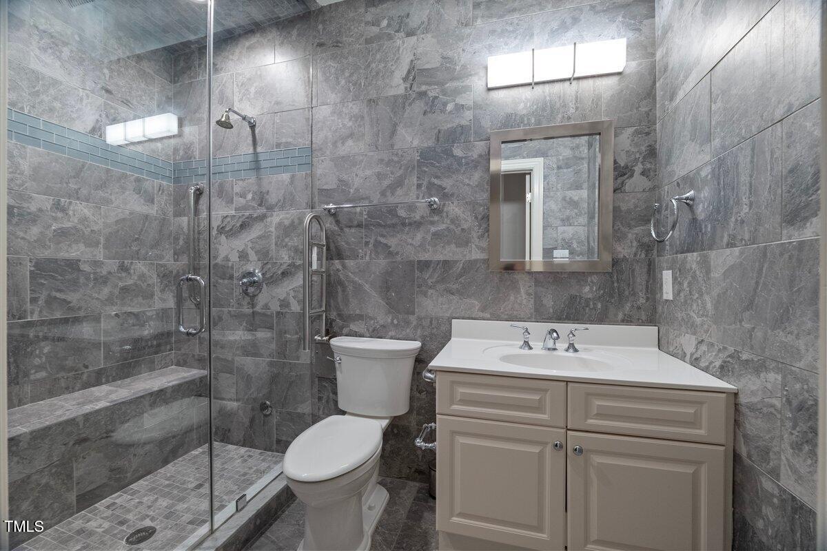 255 Penley Circle Raleigh, NC 27609 - Photo 27 of 35 a bathroom with a sink toilet and shower