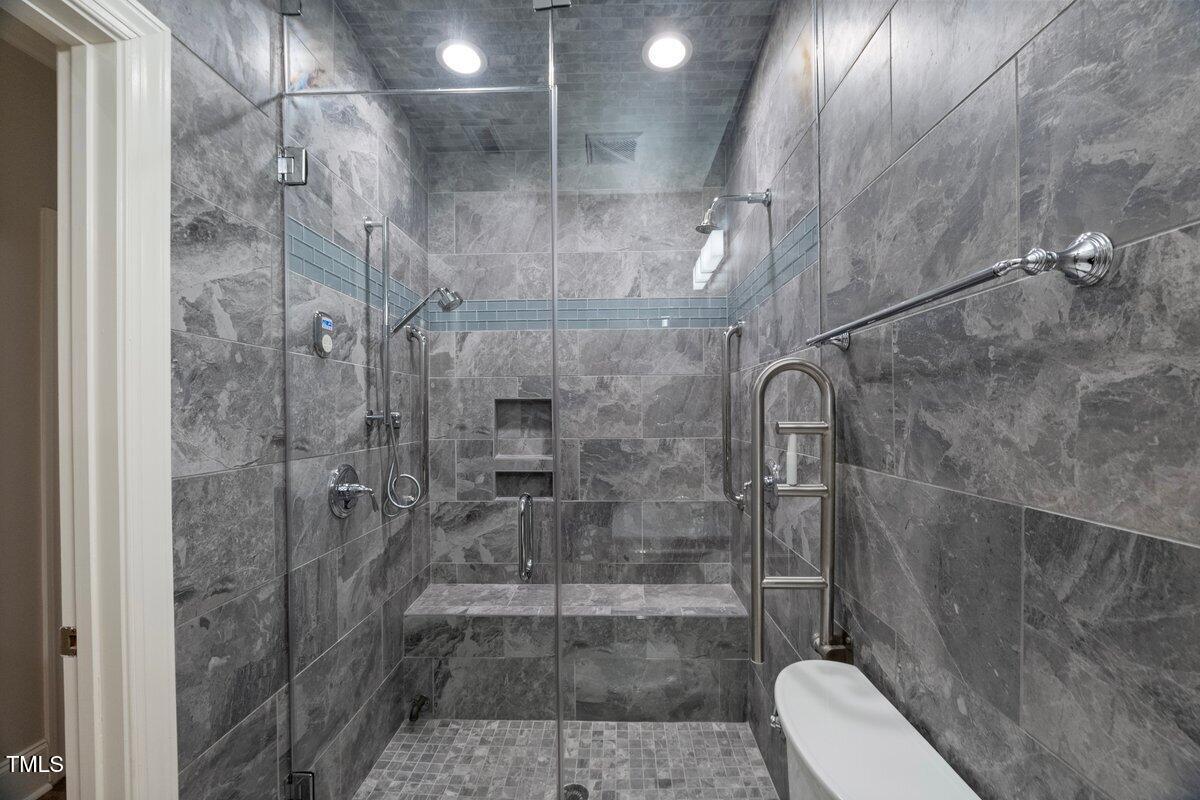 255 Penley Circle Raleigh, NC 27609 - Photo 28 of 35 a bathroom with a shower and toilet