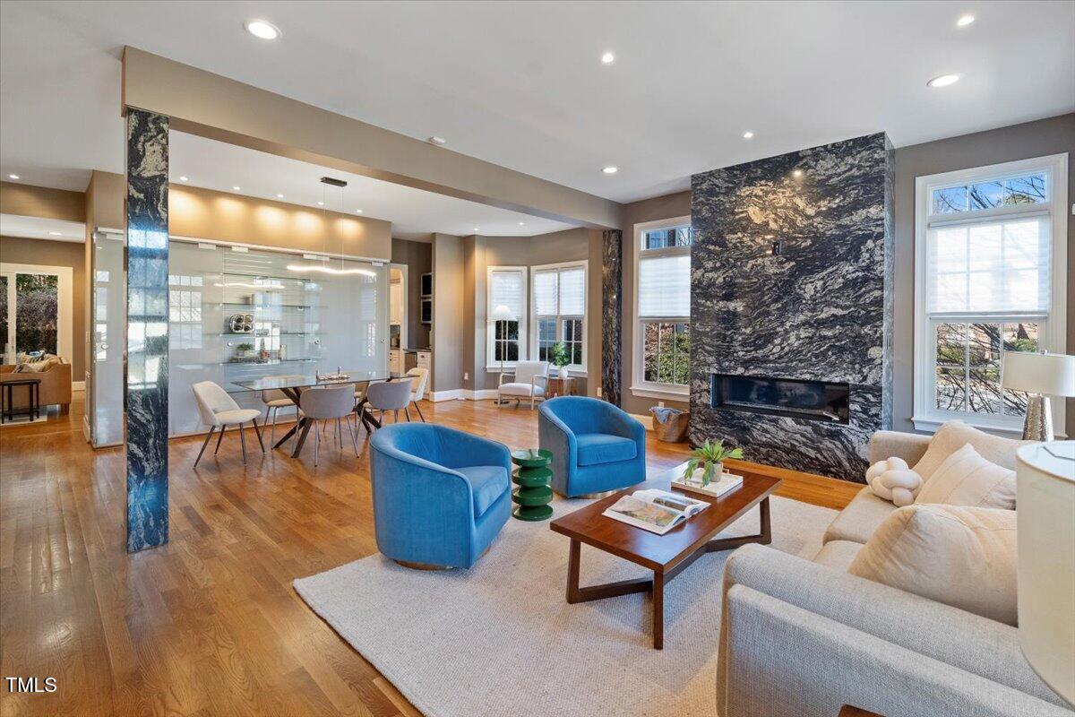 255 Penley Circle Raleigh, NC 27609 - Photo 3 of 35 a living room with fireplace furniture and a large window