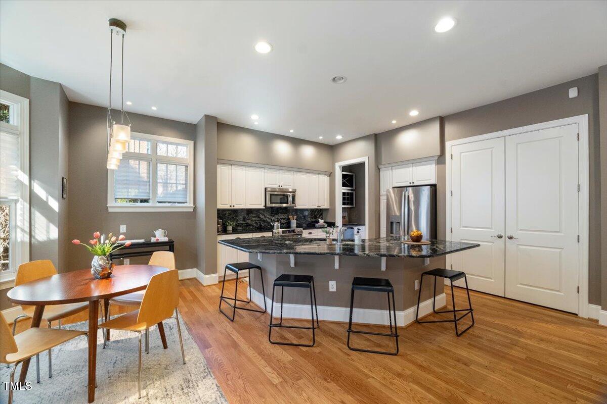 255 Penley Circle Raleigh, NC 27609 - Photo 5 of 35 a view of a a dining room with furniture window and wooden floor