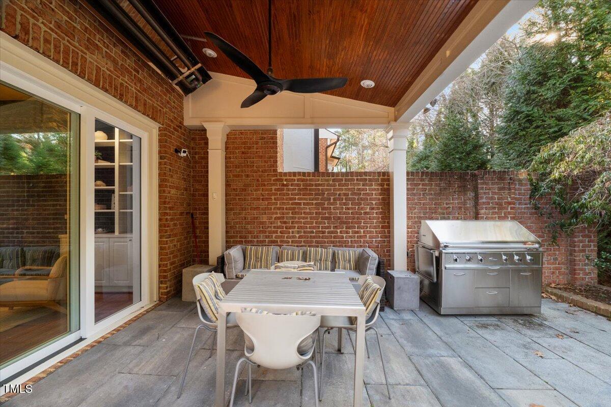 255 Penley Circle Raleigh, NC 27609 - Photo 8 of 35 a patio with table and chairs