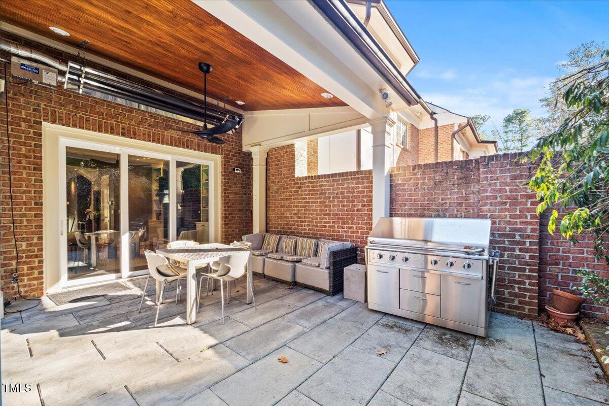 255 Penley Circle Raleigh, NC 27609 - Photo 9 of 35 a patio with table and chairs