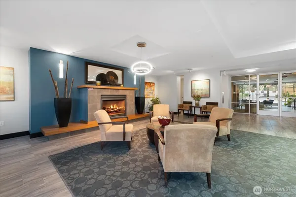 a living room with fireplace furniture and a wooden floor