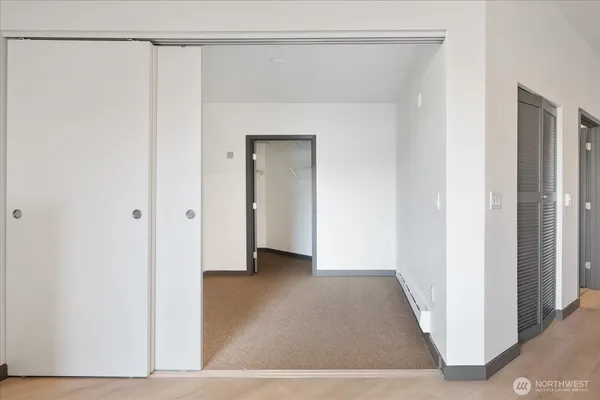 a view of an entryway with wooden floor