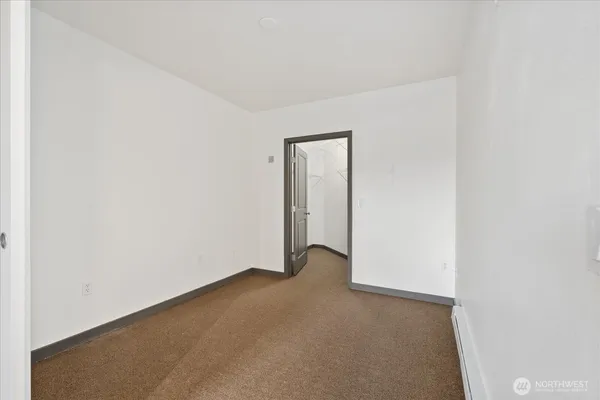 a view of an empty room and entryway