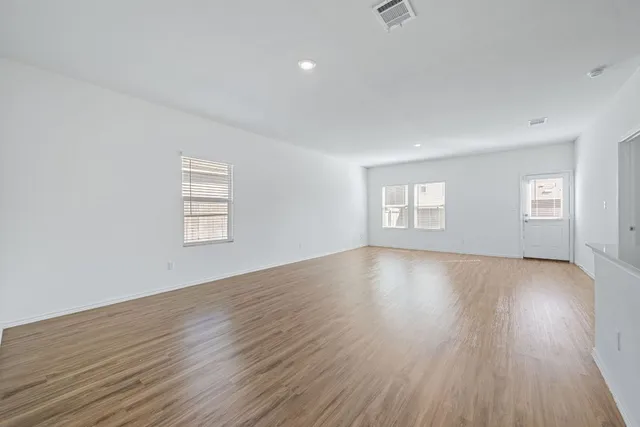 a view of kitchen with furniture and wooden floor