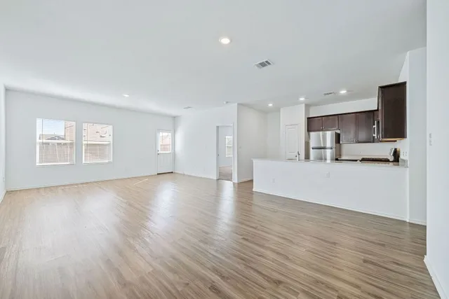 a view of kitchen with wooden floor and window