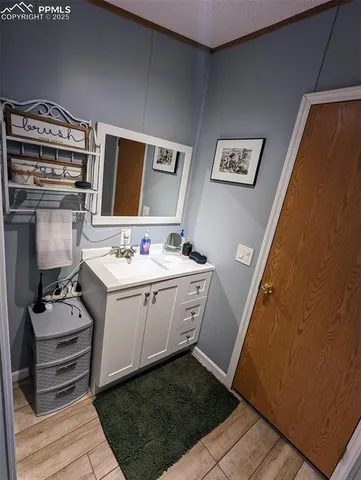 a bathroom with a sink a mirror and a toilet