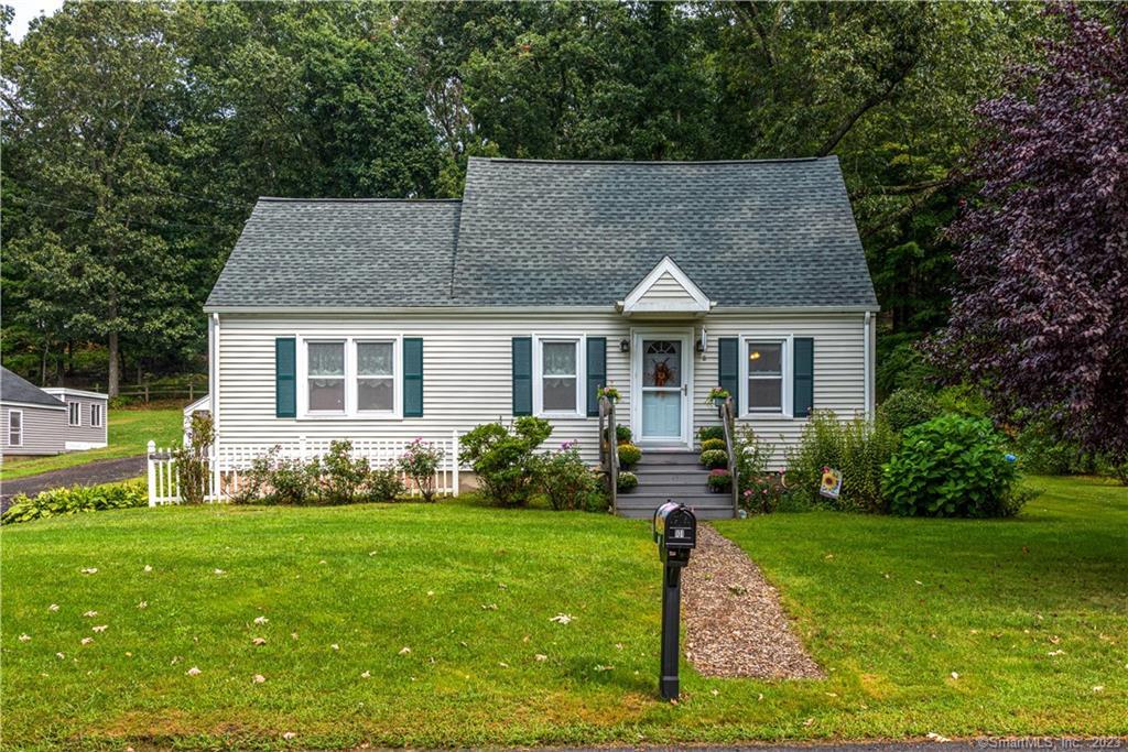 101 Cidermill Road Bolton, CT 06043 - Photo 1 of 1 a front view of house with yard and green space