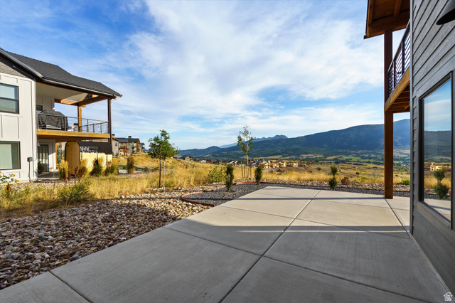 4499 North Seven Bridges Road, Unit 9 Eden, UT 84310 - Photo 49 of 65 Poured concrete patio with a mountain backdrop
