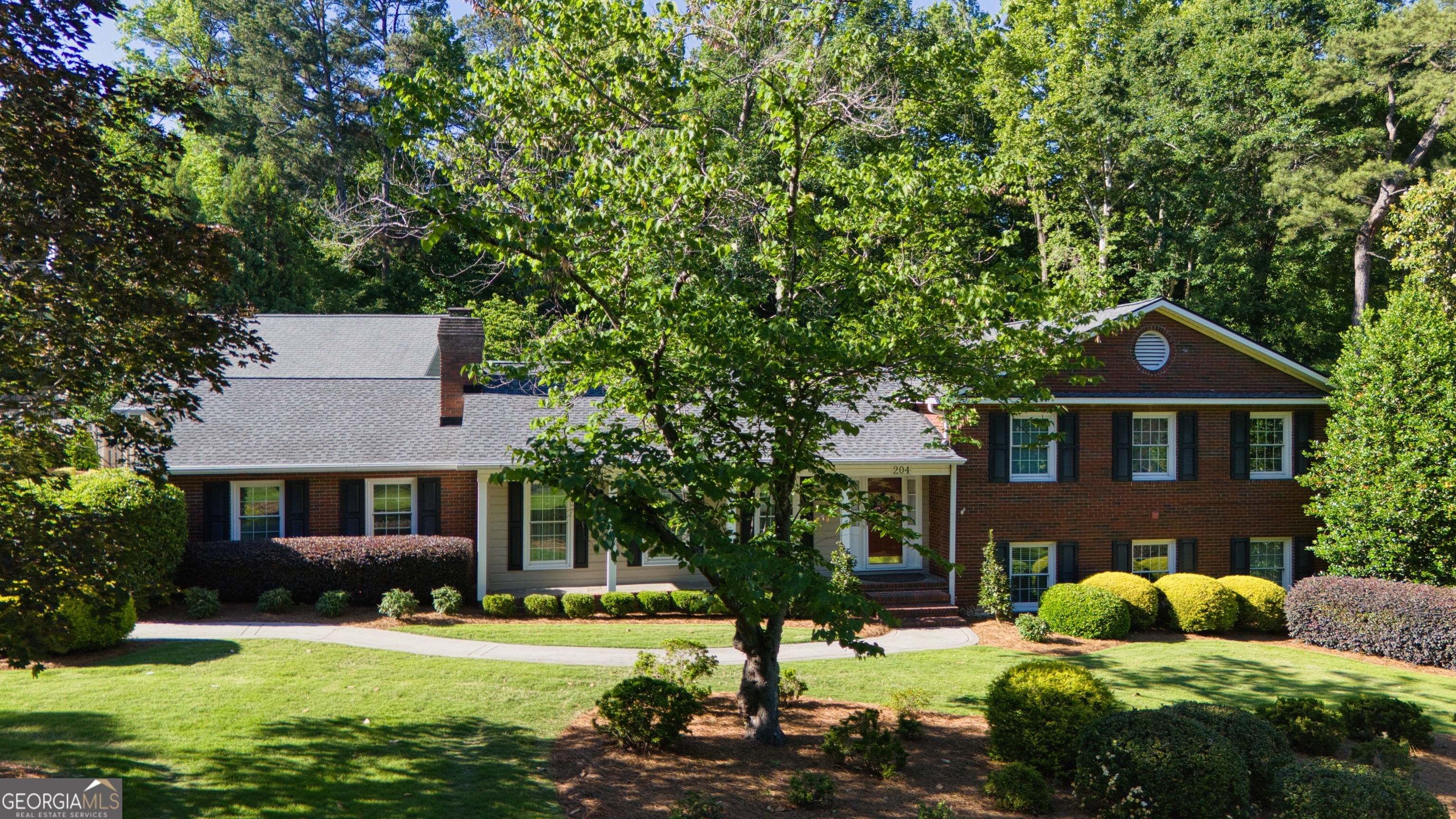 204 Green View Road Southwest Rome, GA 30165 - Photo 1 of 62 a front view of a house with a yard