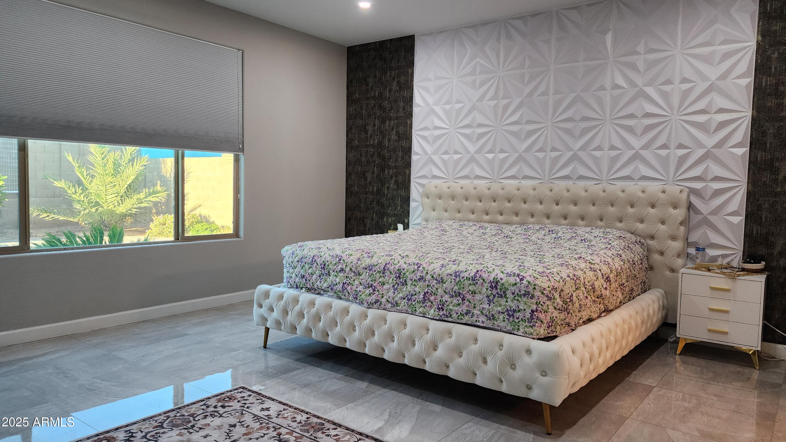 14400 West Bloomfield Road Surprise, AZ 85379 - Photo 11 of 38 a bedroom with a bed lamp and a window