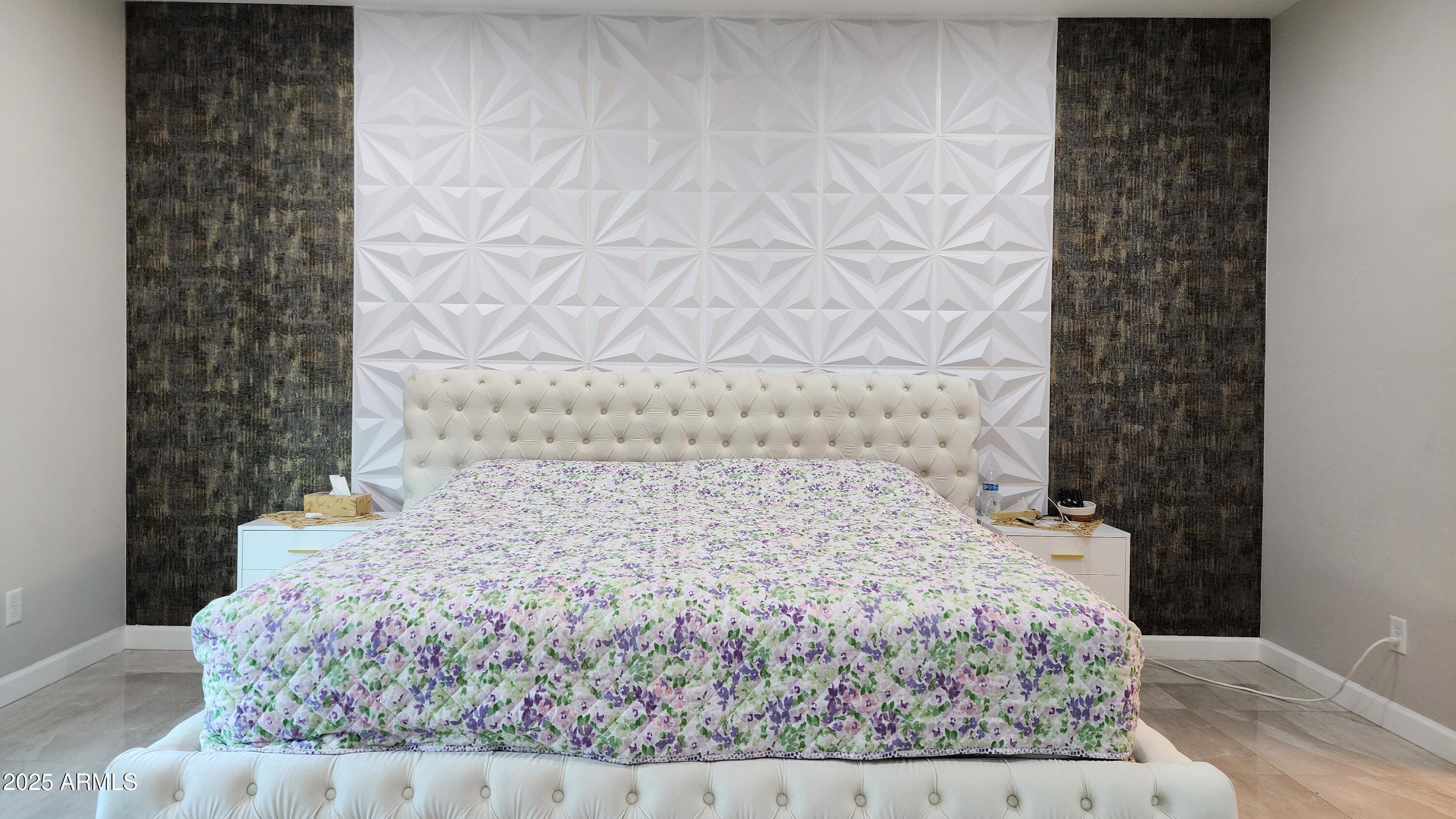 14400 West Bloomfield Road Surprise, AZ 85379 - Photo 12 of 38 a bed sitting in a bathroom next to a white wall