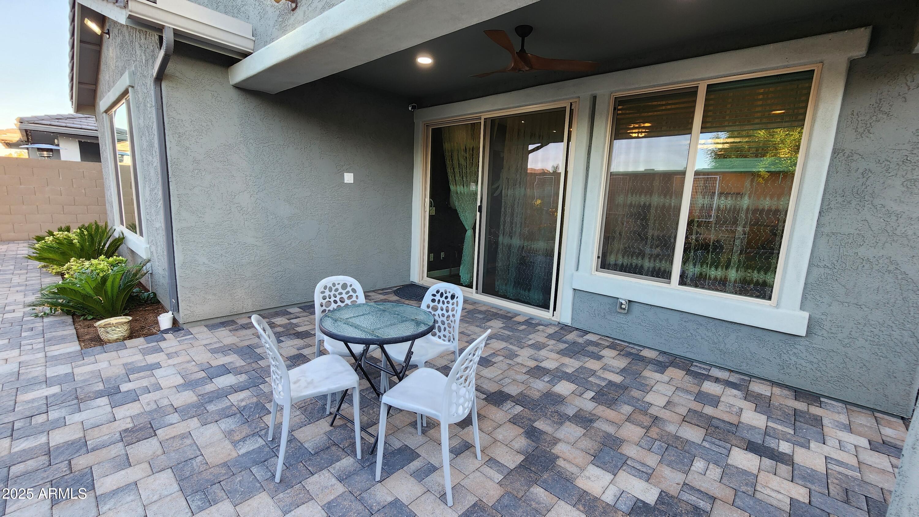 14400 West Bloomfield Road Surprise, AZ 85379 - Photo 13 of 38 a backyard of a house with table and chairs