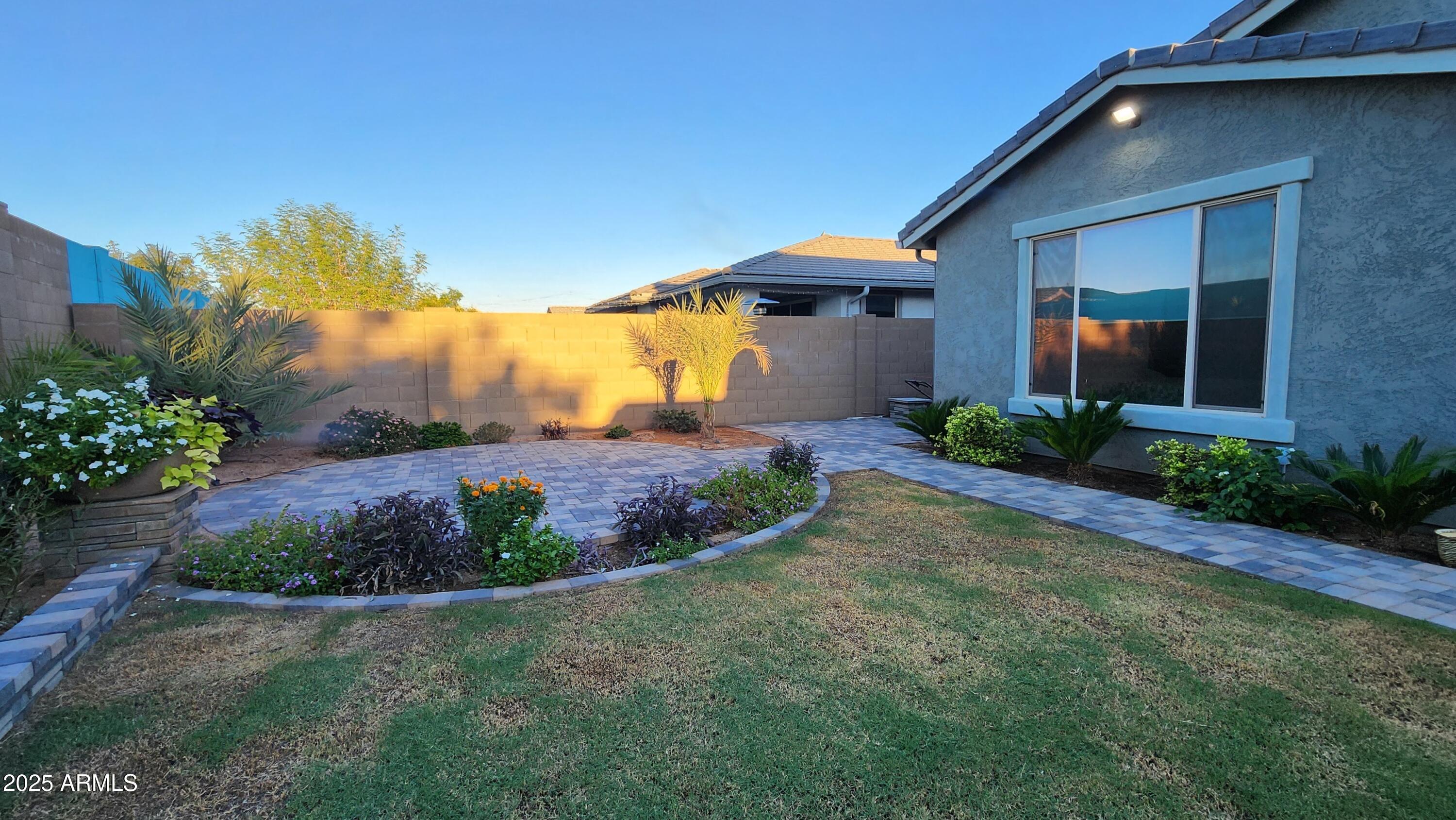 14400 West Bloomfield Road Surprise, AZ 85379 - Photo 19 of 38 a front view of a house with a yard
