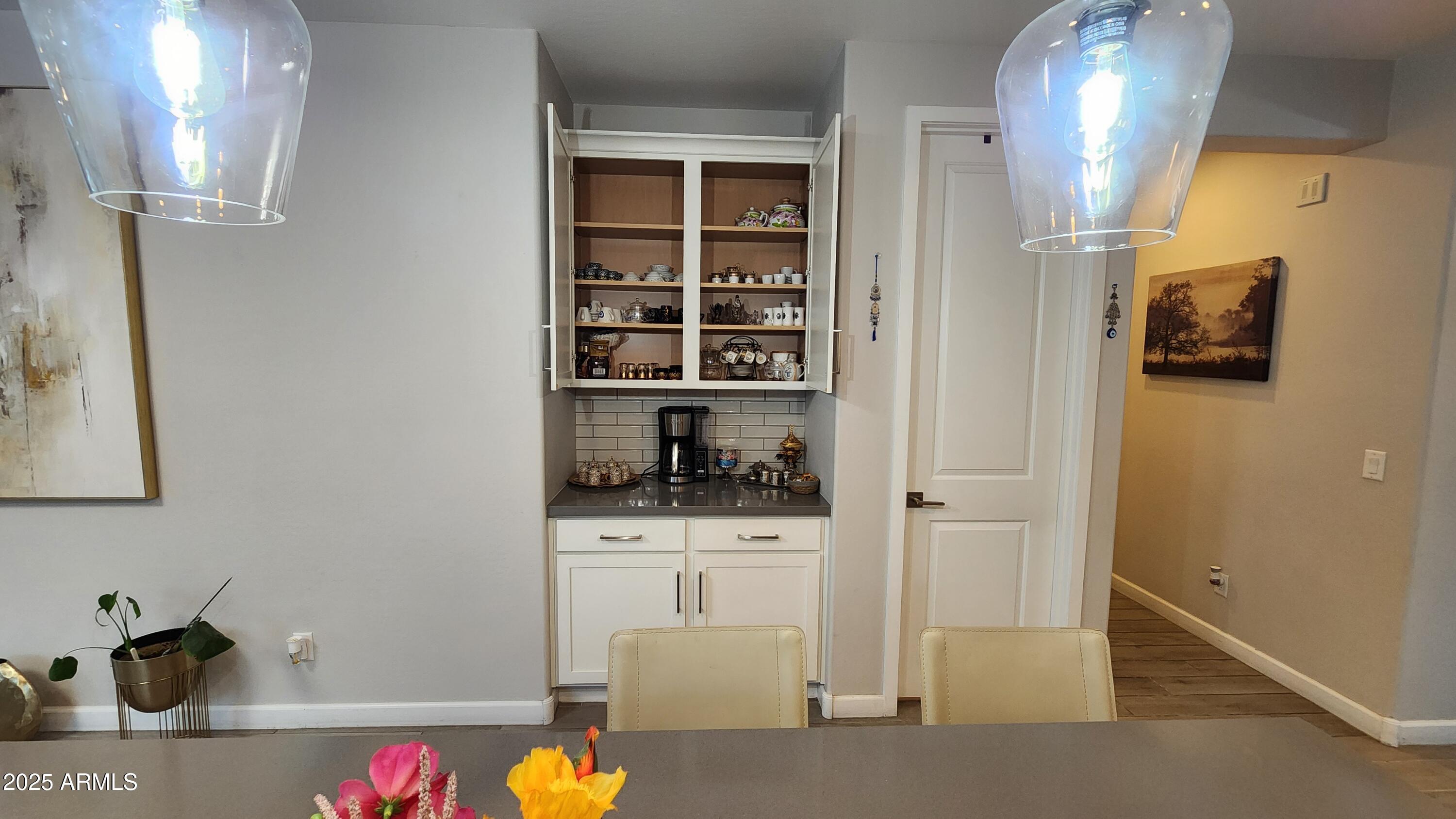 14400 West Bloomfield Road Surprise, AZ 85379 - Photo 25 of 38 a kitchen with granite countertop a sink and cabinets