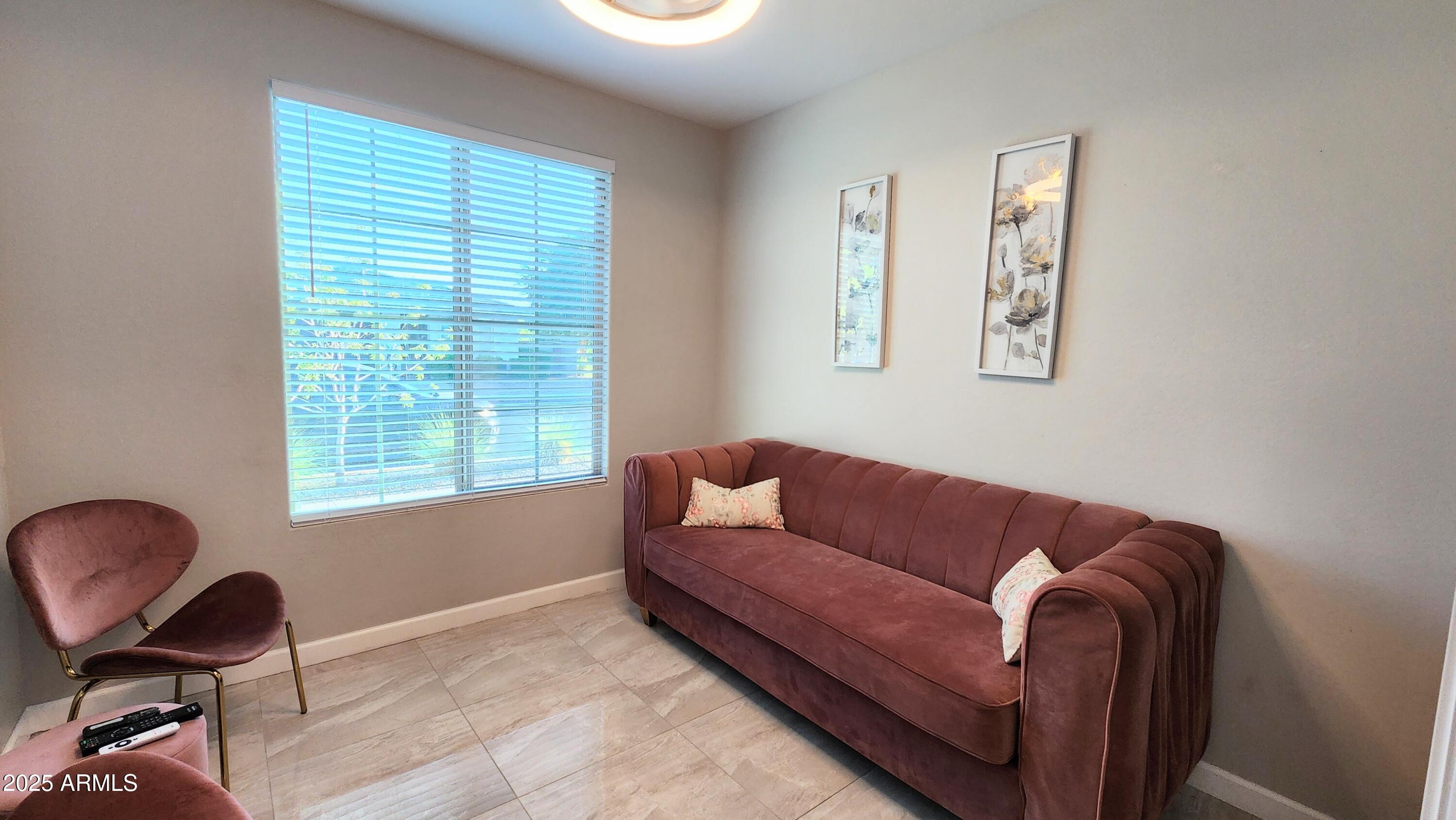 14400 West Bloomfield Road Surprise, AZ 85379 - Photo 28 of 38 a living room with furniture and a window