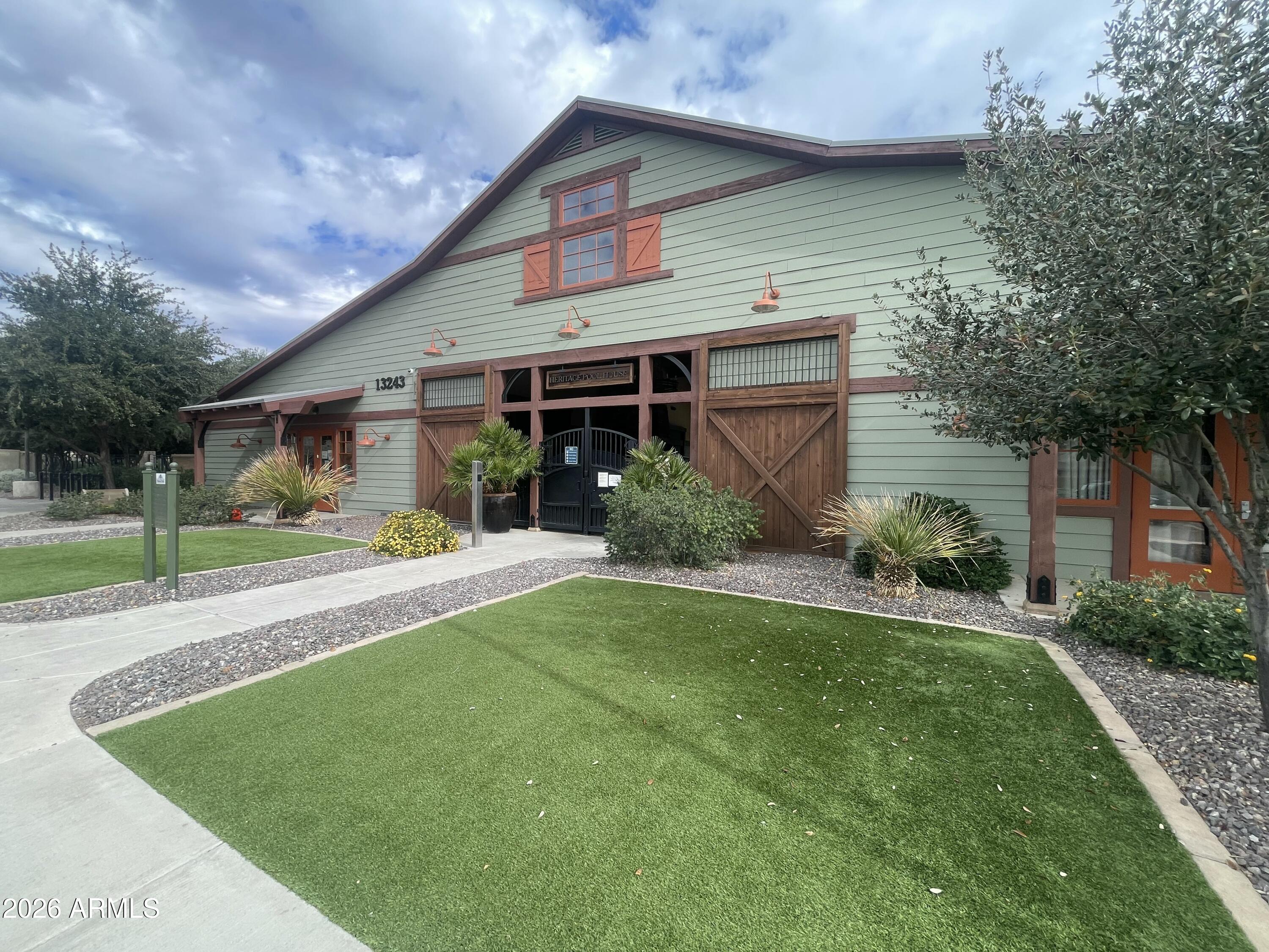 14400 West Bloomfield Road Surprise, AZ 85379 - Photo 33 of 38 a front view of a house with a yard and garage