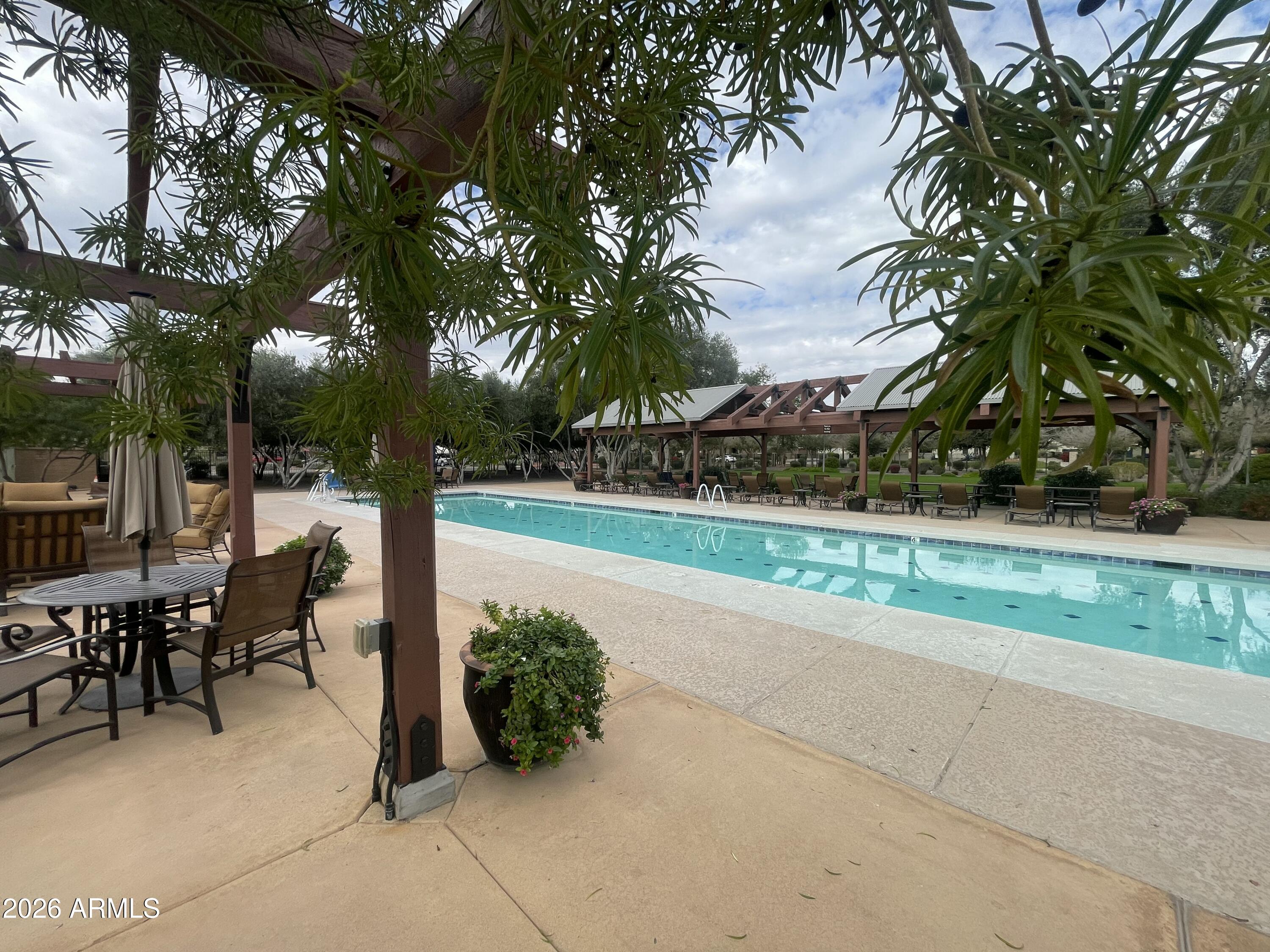 14400 West Bloomfield Road Surprise, AZ 85379 - Photo 38 of 38 a view of a patio with table and chairs and potted plants