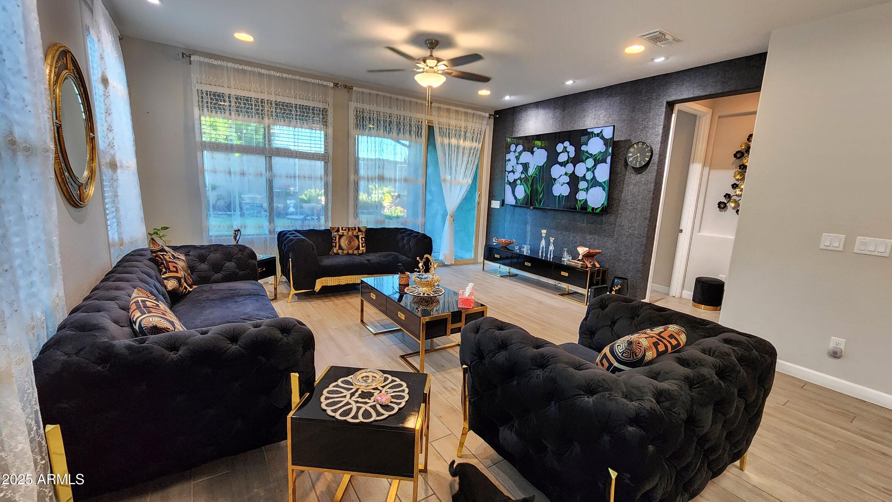 14400 West Bloomfield Road Surprise, AZ 85379 - Photo 9 of 38 a living room with furniture and a large window