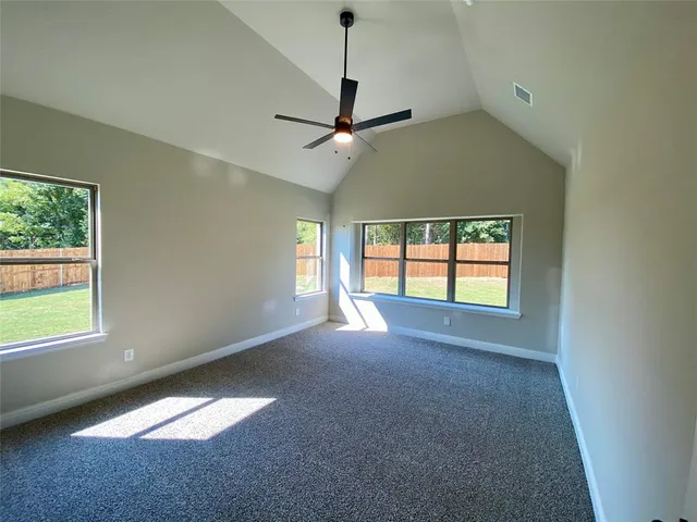 a spacious bathroom with a granite countertop tub shower and closet
