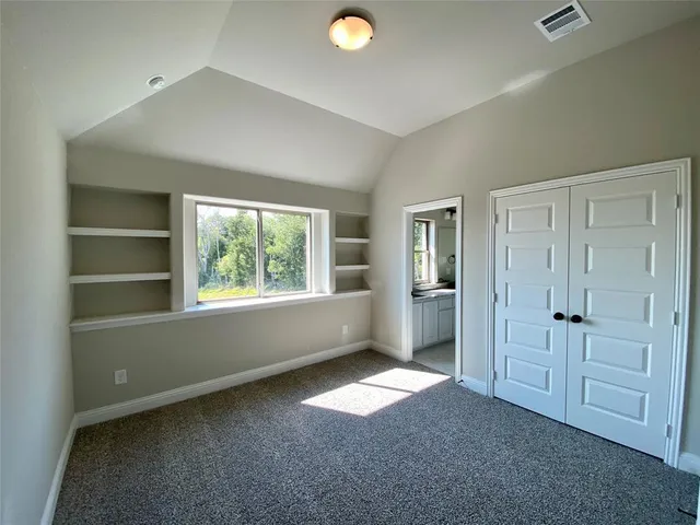 a bathroom with a toilet and a bathtub
