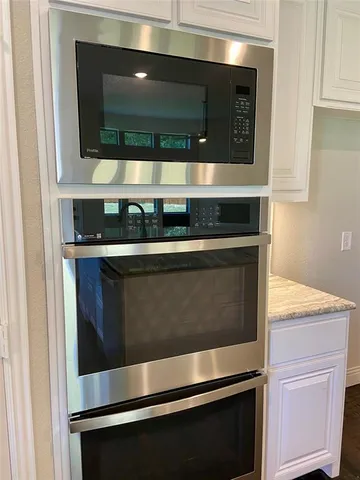 a kitchen with a stove and a sink