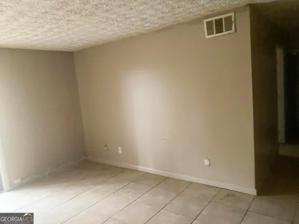 a bathroom with a toilet and a mirror