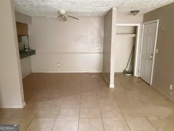 a view of a room with a refrigerator