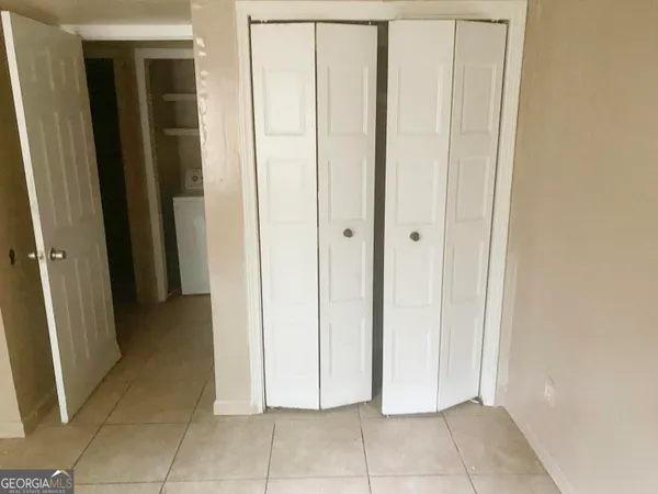 a view of a livingroom with an empty space and a sink