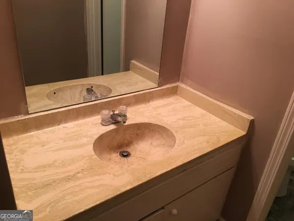 a bathroom with a sink and a toilet