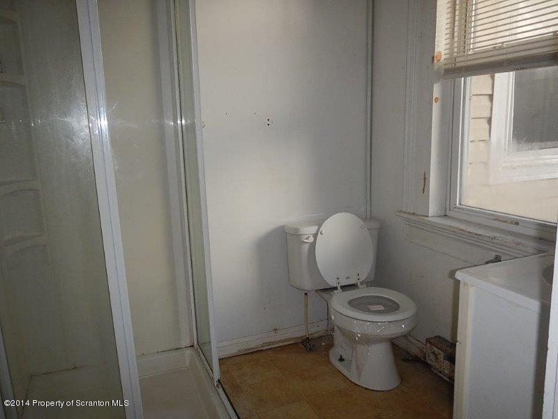 206 Ridge Street Honesdale, PA 18431 - Photo 13 of 25 a white toilet sitting next to a window