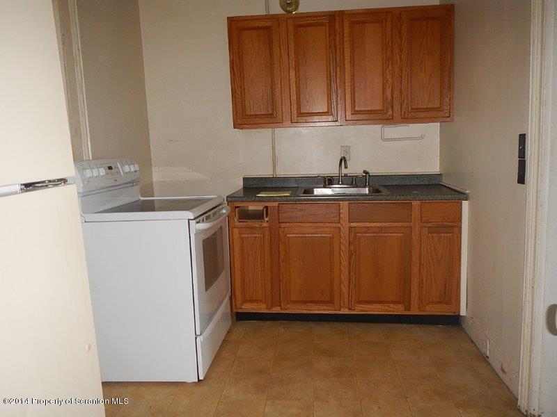 206 Ridge Street Honesdale, PA 18431 - Photo 14 of 25 a kitchen with stainless steel appliances granite countertop a sink and a stove