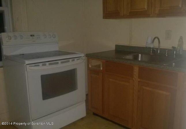 206 Ridge Street Honesdale, PA 18431 - Photo 6 of 25 a bathroom with a sink and cabinets