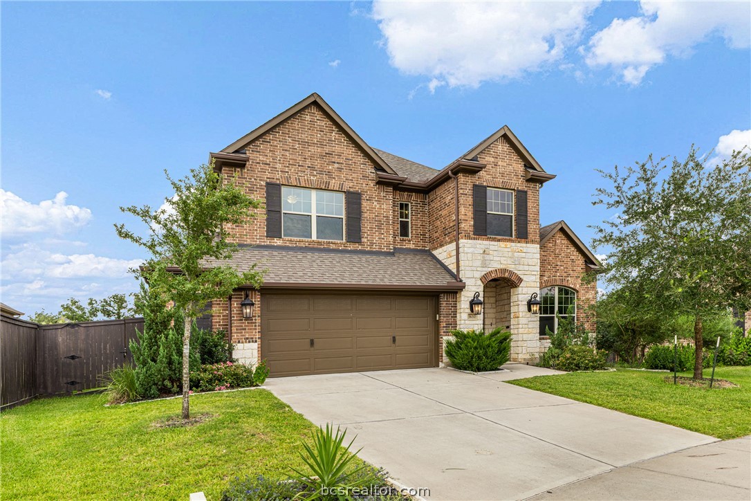 3632 Haskell Hollow Loop College Station, TX 77845 - Photo 1 of 1 Craftsman inspired home with concrete driveway, a shingled roof, stone siding, an attached garage, and brick siding