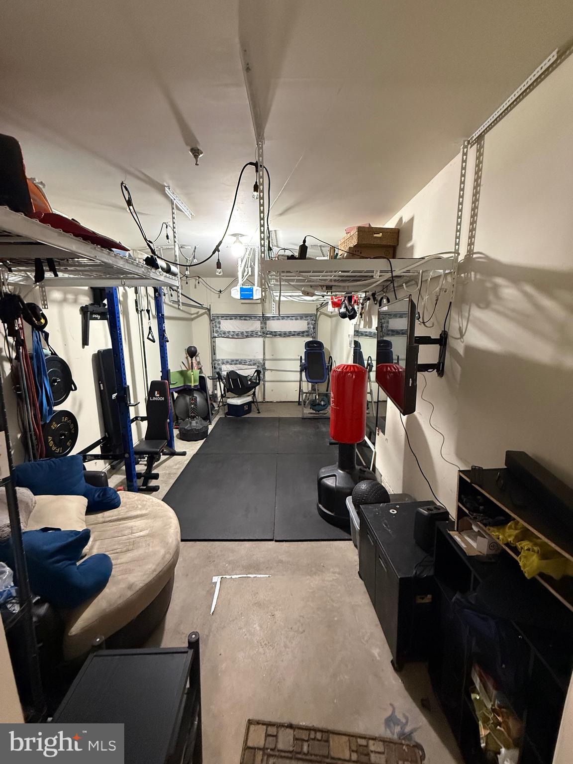 4617 Hummingbird Lane, Unit 110 Fairfax, VA 22033 - Photo 14 of 45 a gym room with lots of gym equipment