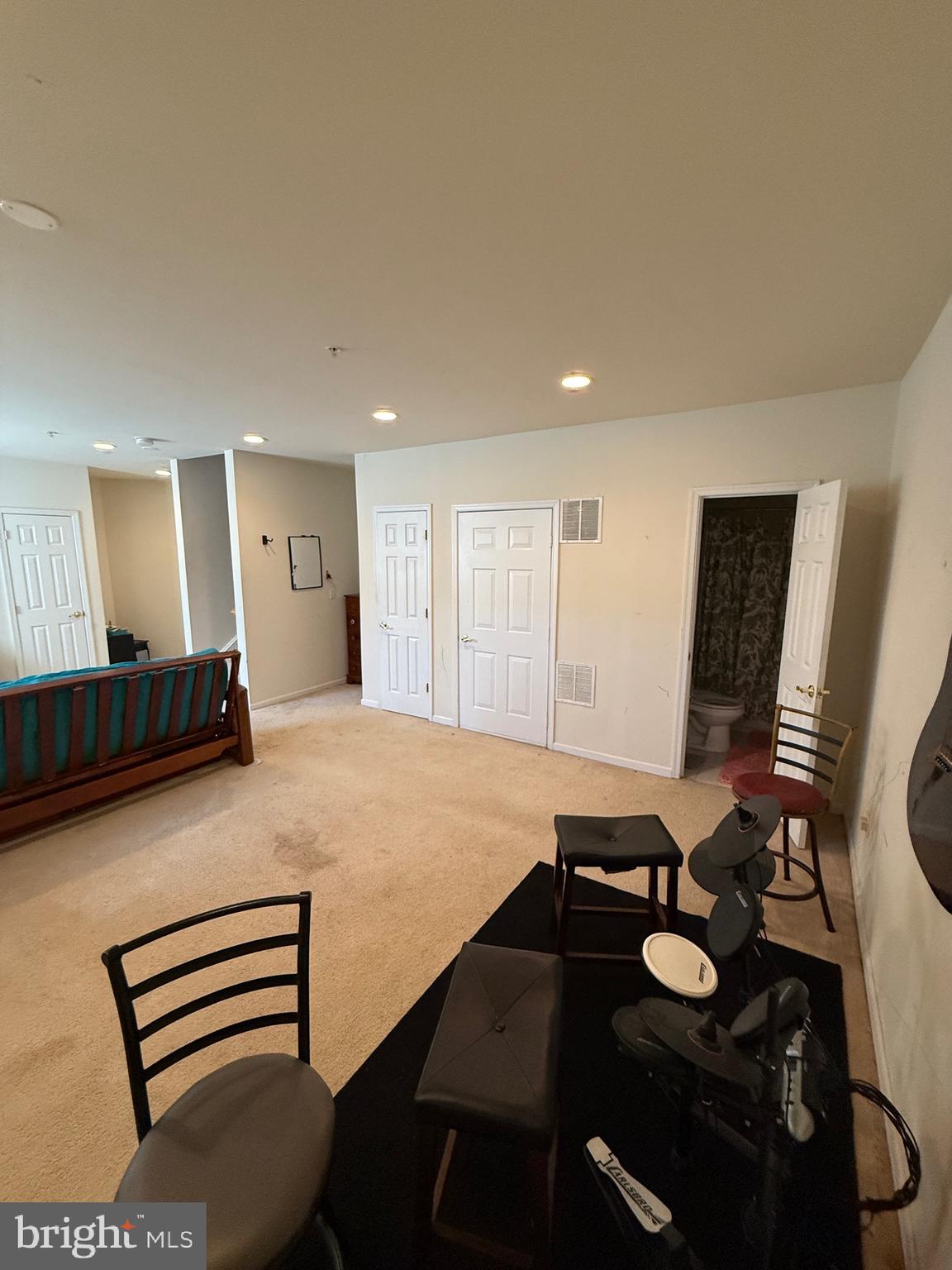 4617 Hummingbird Lane, Unit 110 Fairfax, VA 22033 - Photo 16 of 45 a room with furniture and flat screen tv