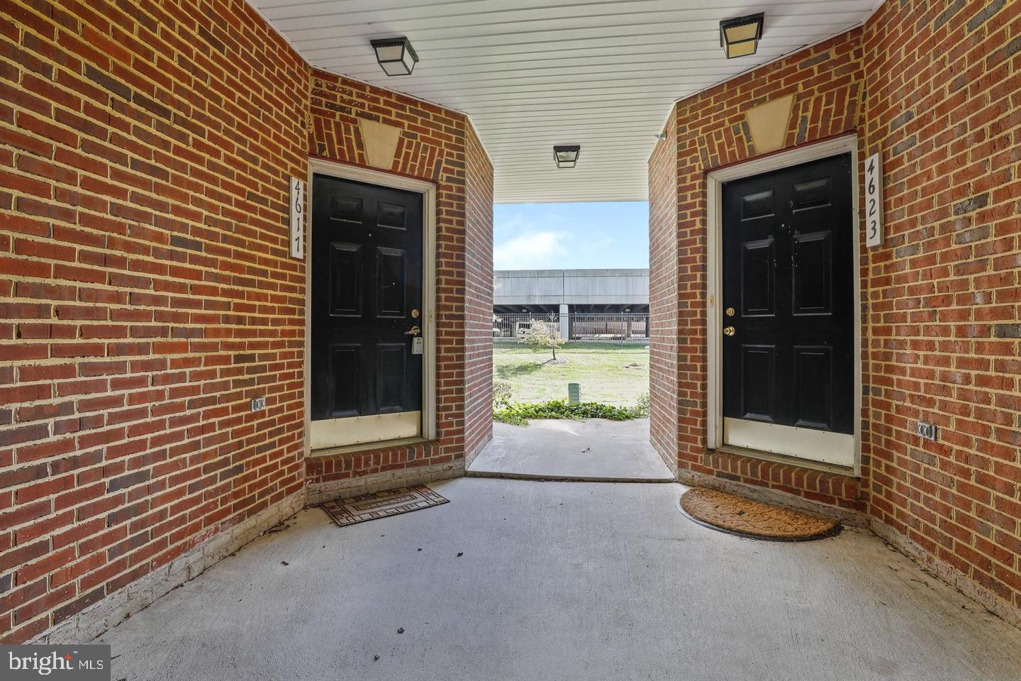 4617 Hummingbird Lane, Unit 110 Fairfax, VA 22033 - Photo 2 of 45 a backyard of a house with barbeque oven